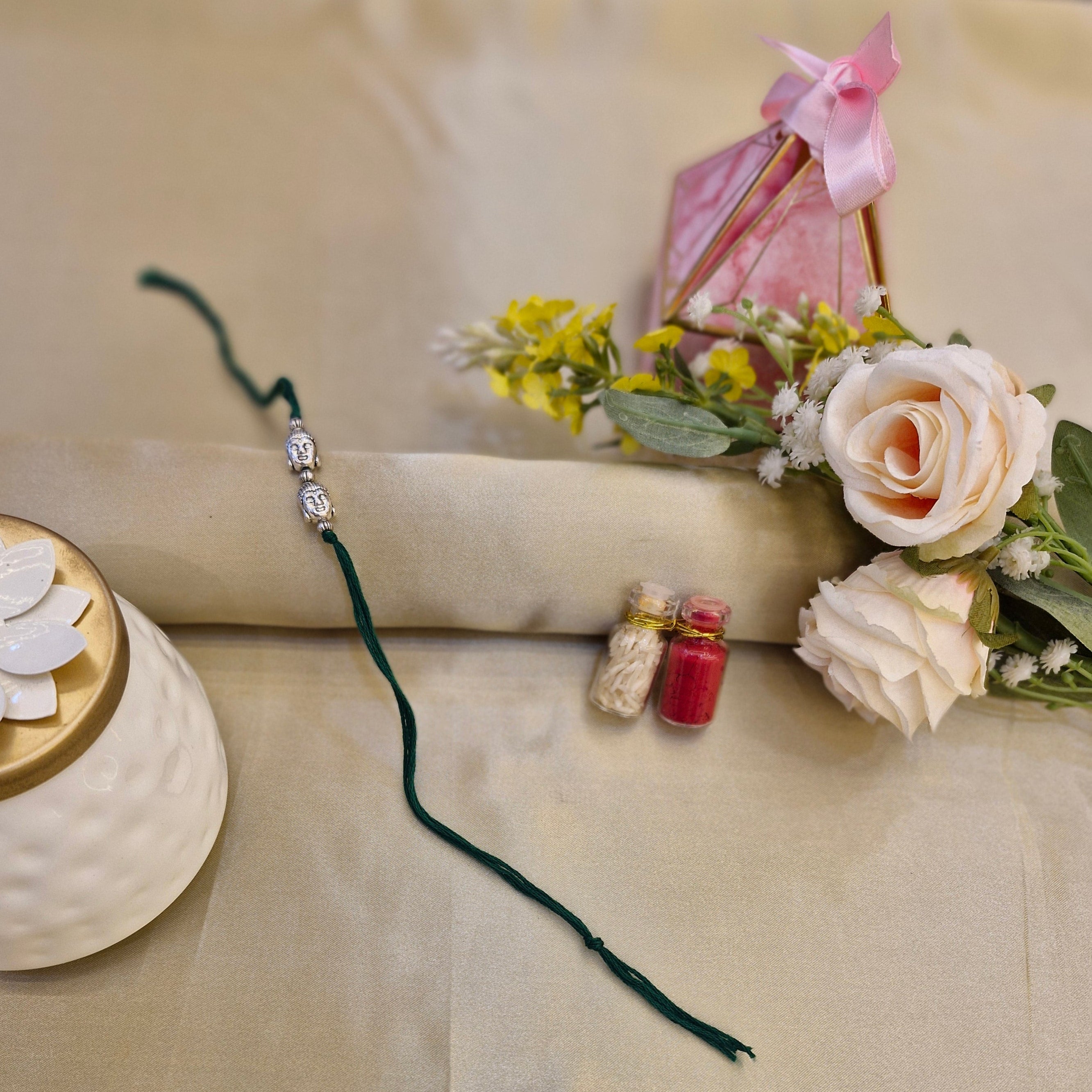 Decorative item with flowers and a string on a beige background