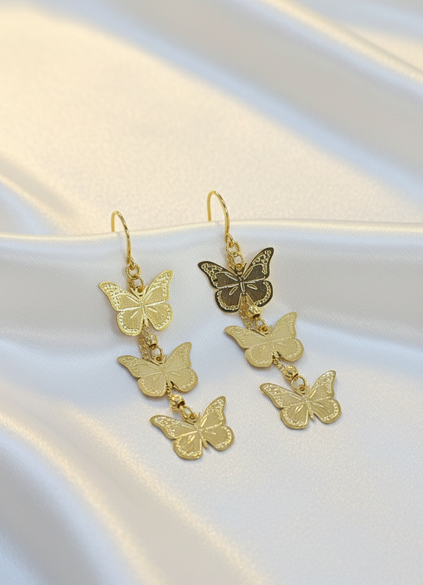 Gold Butterfly Cascade Statement Earrings