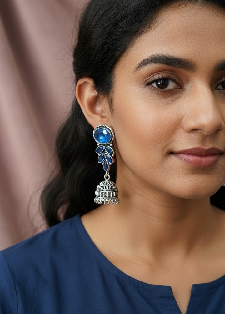 Royal Azure Jhumkas: Antique Silver-Finished Earrings with Cobalt Blue Crystals